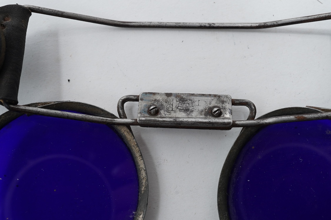 A pair of WW2 ARP fire fighter’s blue tinted goggles, stamped GR below a crown, probably by Fleming London